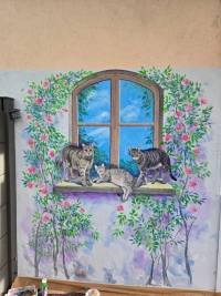 {"de": "Katzen an der Fassade", "en": "Cats on the facade", "uk": "Коти на фасаді"}